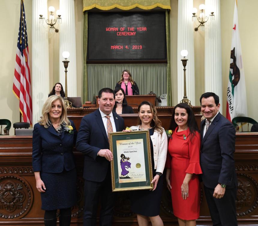 Assemblymember Grayson presents Midsi Sanchez with a Resolution on the Assembly Floor