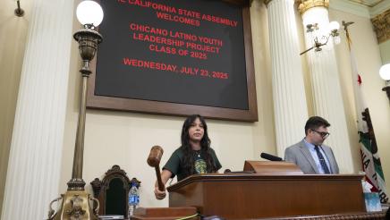 Student speaker with gavel CLYLP Mock Session