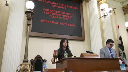 Student speaker with gavel CLYLP Mock Session